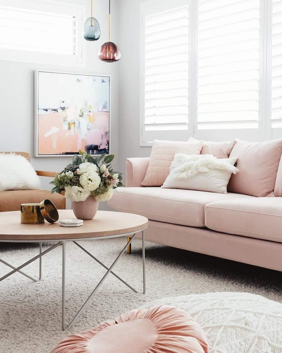Blush Pink Sofa with Abstract Art