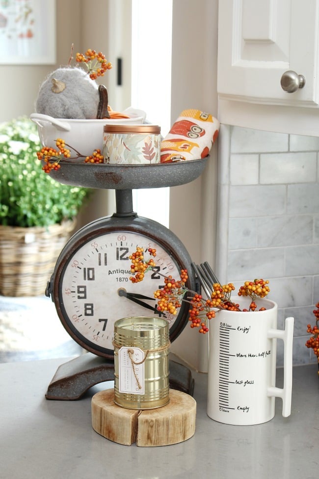 A dream fall kitchen with antiques and foliage
