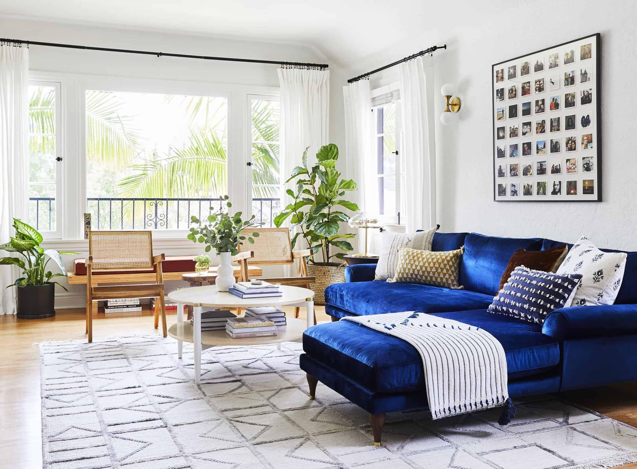 Open Space Living Room Interior with a Navy Blue Sofa and an Armchair. Rug  on the Floor and Graphic Decorations on the Wall Stock Image - Image of  living, inside: 127604013