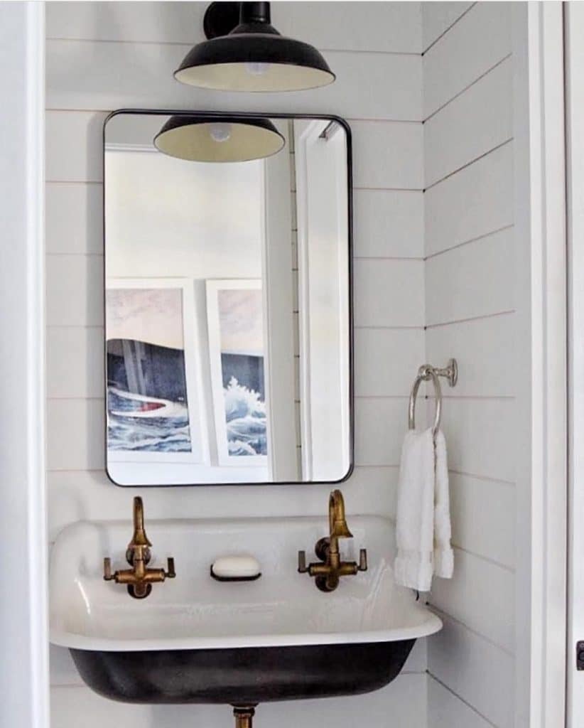 small guest bathroom with white shiplap