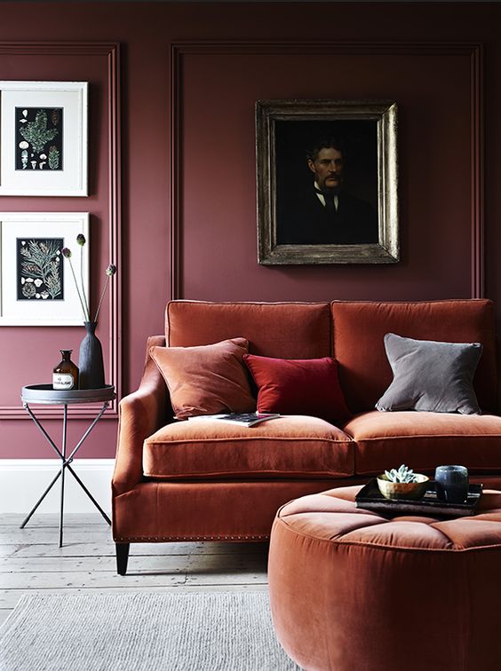 modern rust sofa and a matching round ottoman is what you need for a strong fall feel