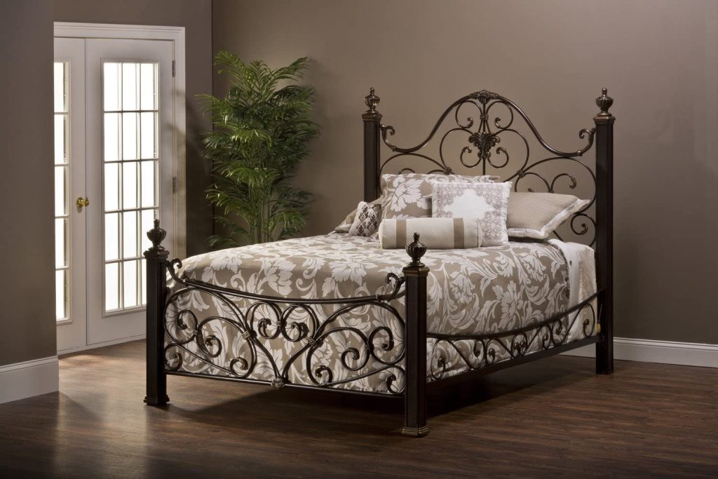 Antique Iron Bed and a Floral Bedspread
