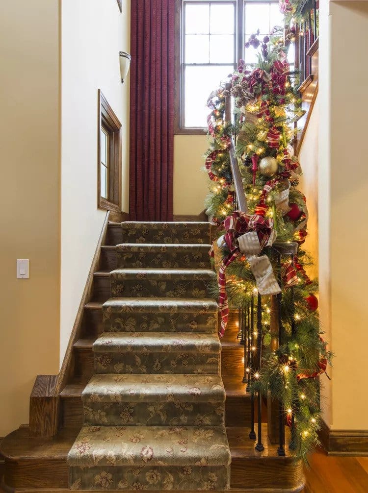 adorn your staircase with faux garlands