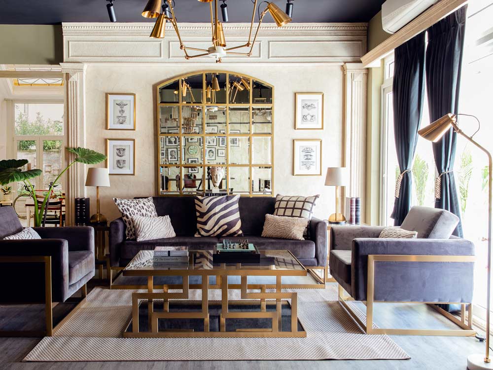 Elegant drawing room interiors with brass décor elements