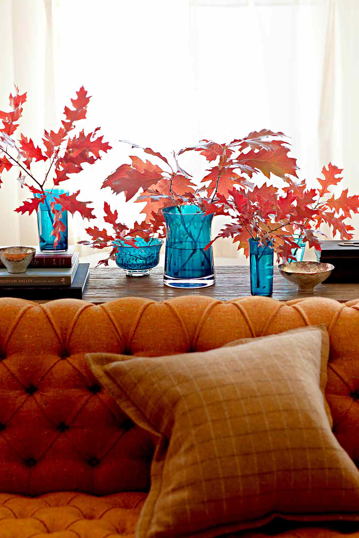 fall leaves blue glass vases couch