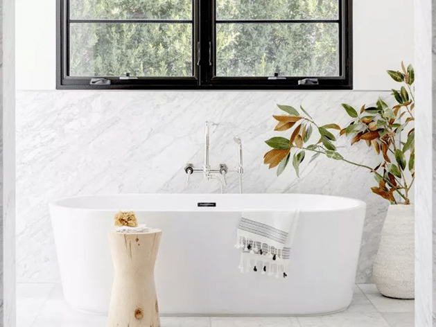 white bathtub with a splash of the dark