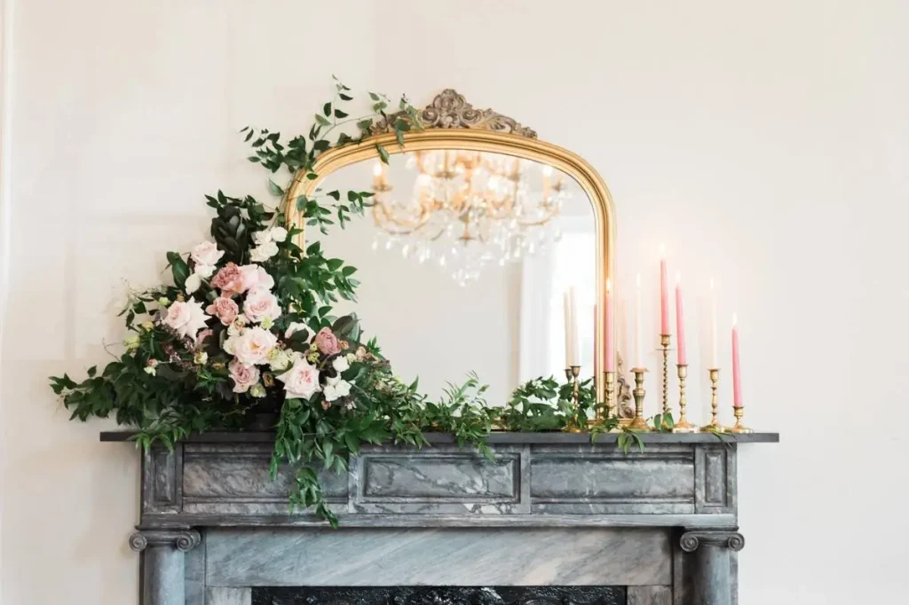 mantel with a huge mirror and dried flowers