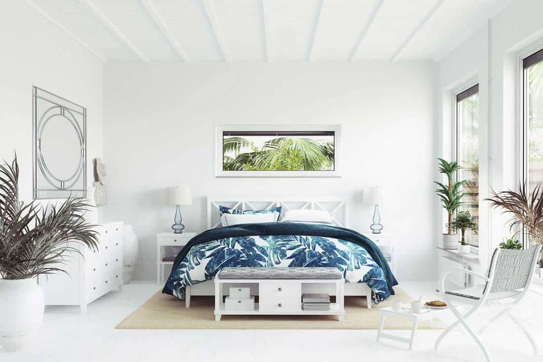 Which furniture materials and finishes complement coastal bedroom decor