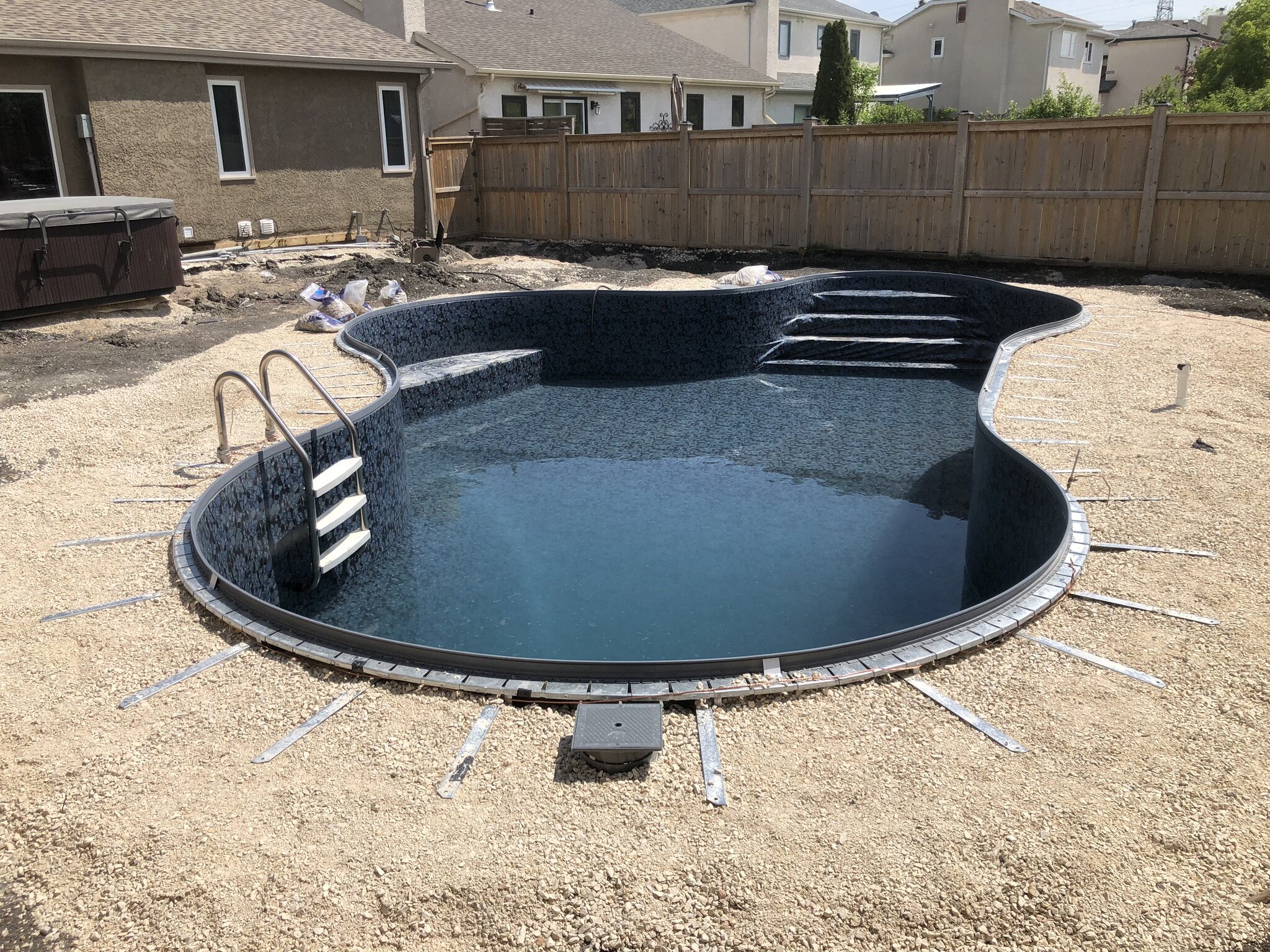 What Materials Are Used in The Construction of a Black Bottom Pool?