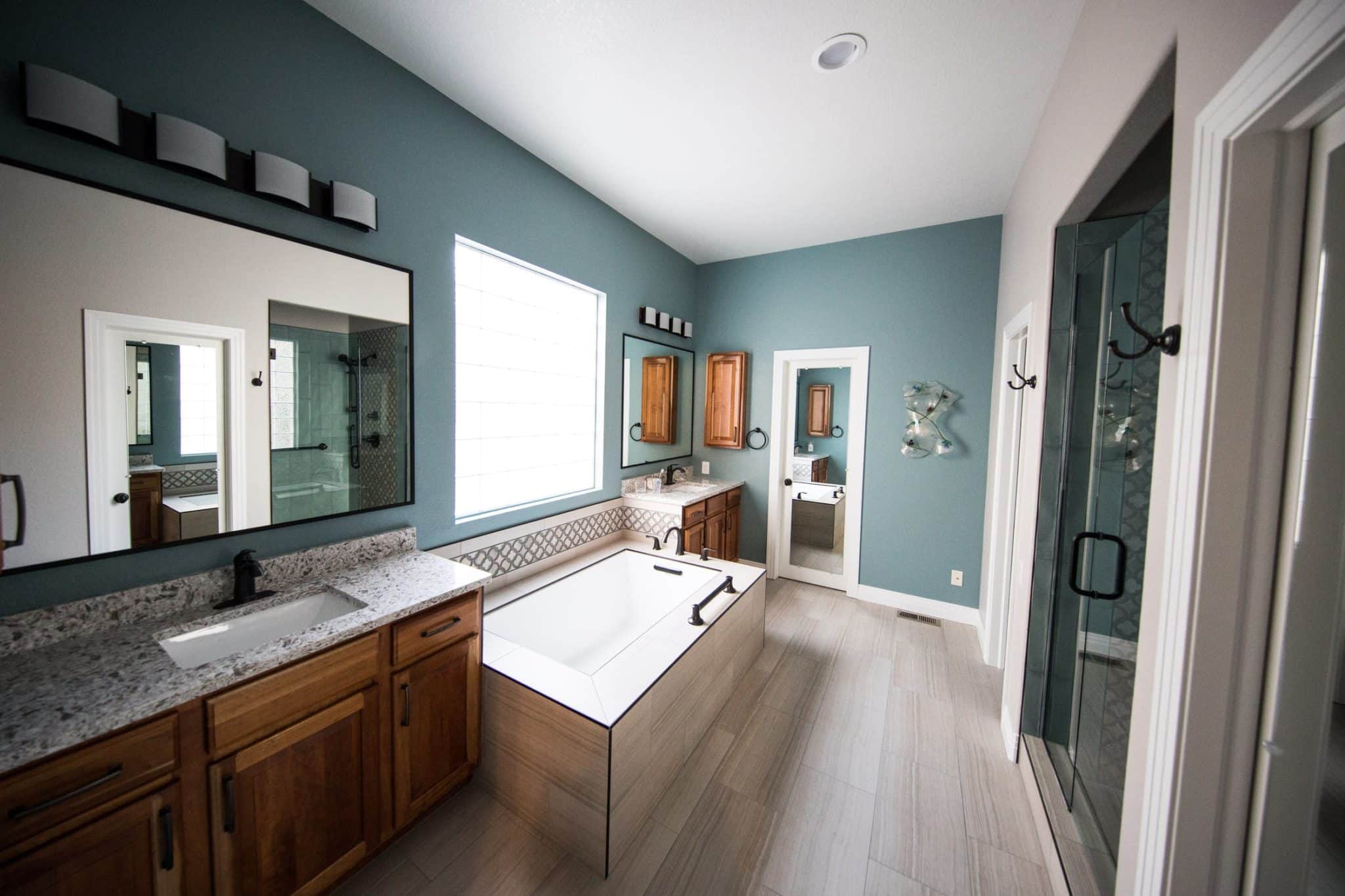 What Types of Finishes Work Well in a Dark Green Bathroom?