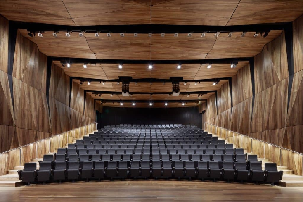 Spacious auditorium with wooden walls,