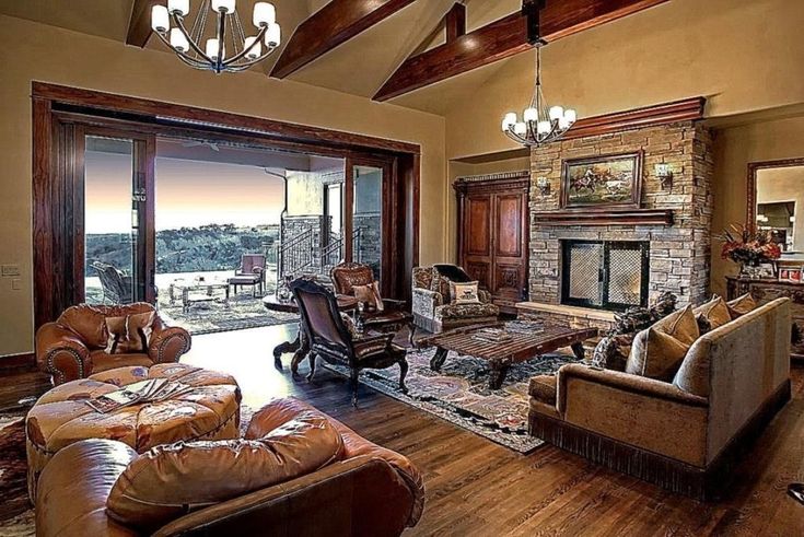 A spacious living room adorned with a cozy fireplace and comfortable couches, creating the perfect interior ambiance
