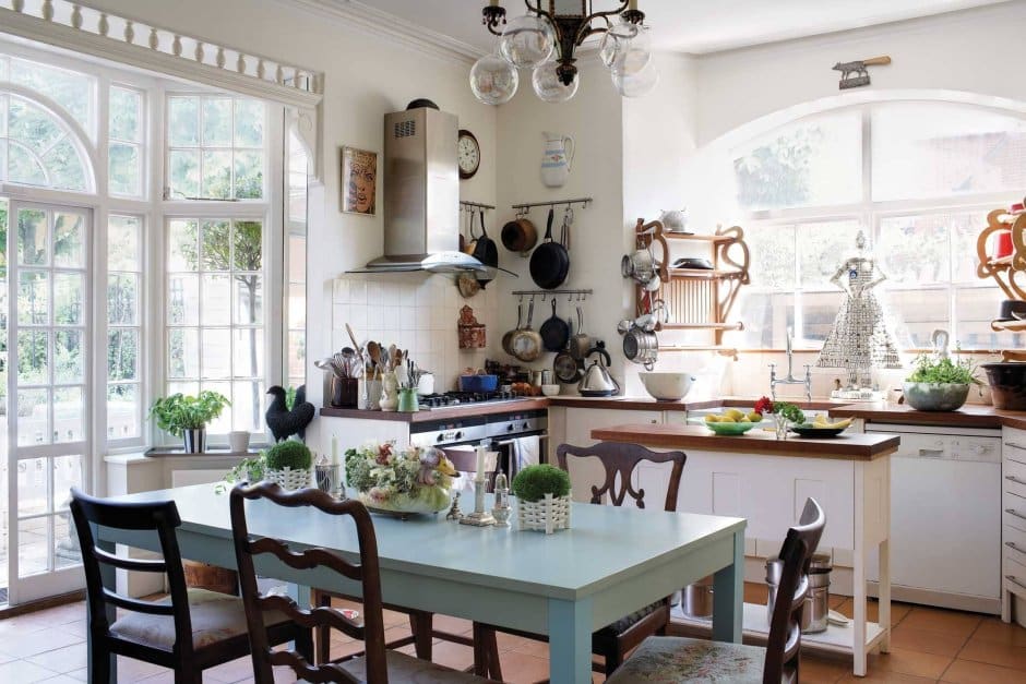Charming kitchen featuring a table and chairs