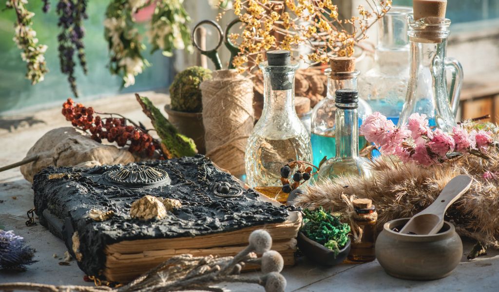Table displaying diverse herbs and potions, showcasing the uniqueness of Bohemian Halloween decor