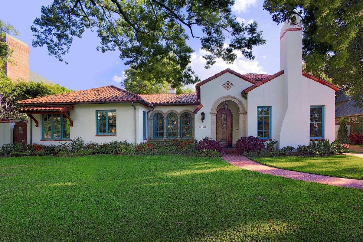 Single-story Spanish style homes feature a distinct architectural design with clay tile roofs, stucco exteriors, and arched doorways